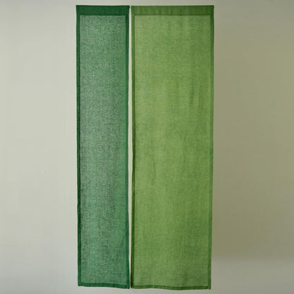 alternate angle of Soft Tone Noren — Leaf Green hanging as a two-panel doorway curtain