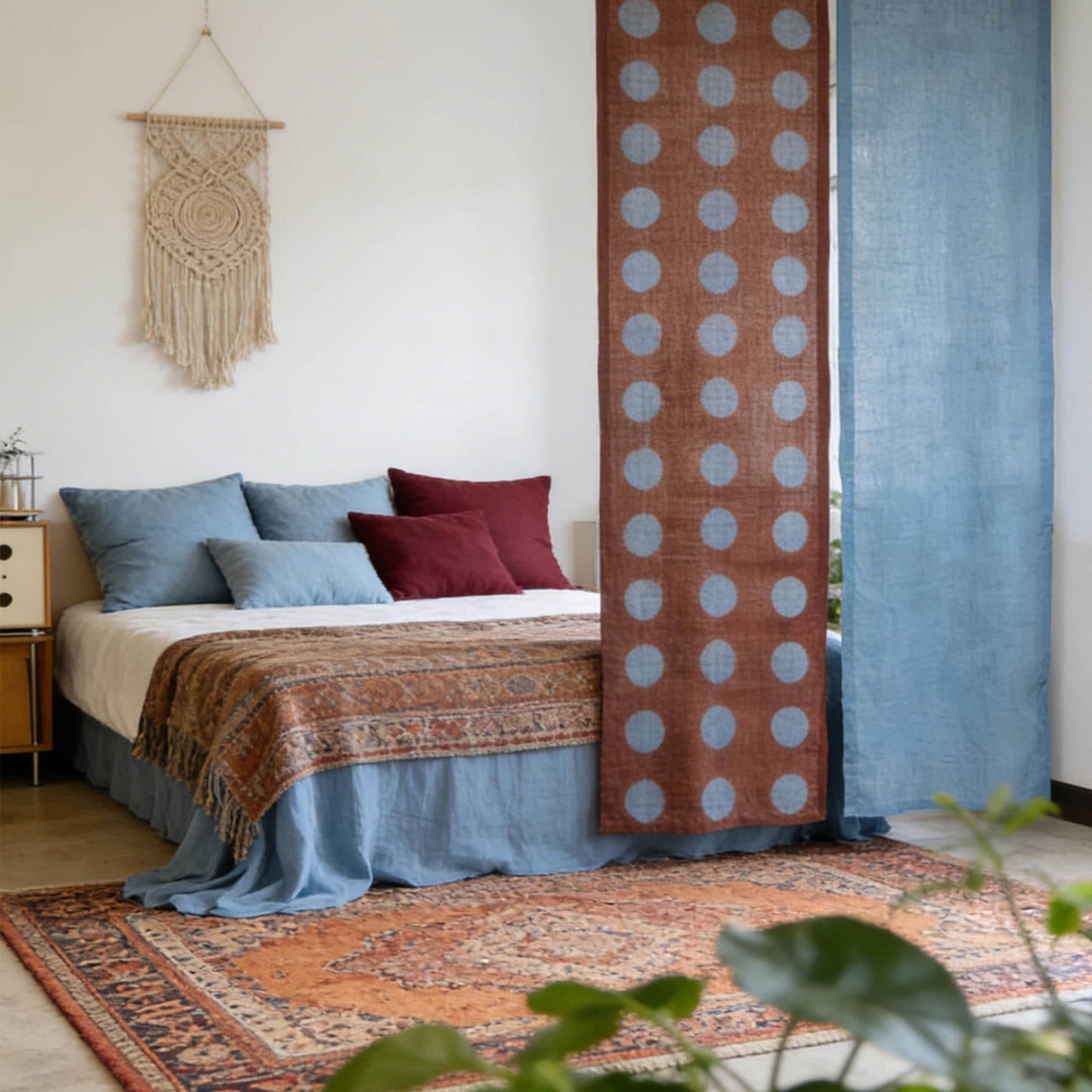 close-up of Polka Dot Linen Noren — Rust / Blue showing the natural resist-dye motif on linen