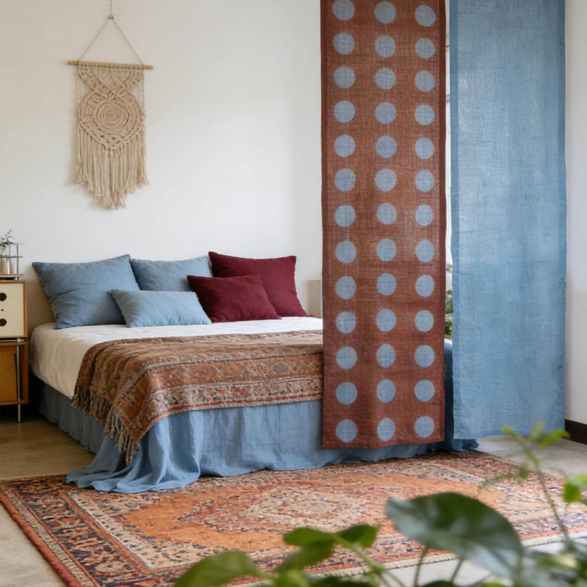 close-up of Polka Dot Linen Noren — Rust / Blue showing the natural resist-dye motif on linen