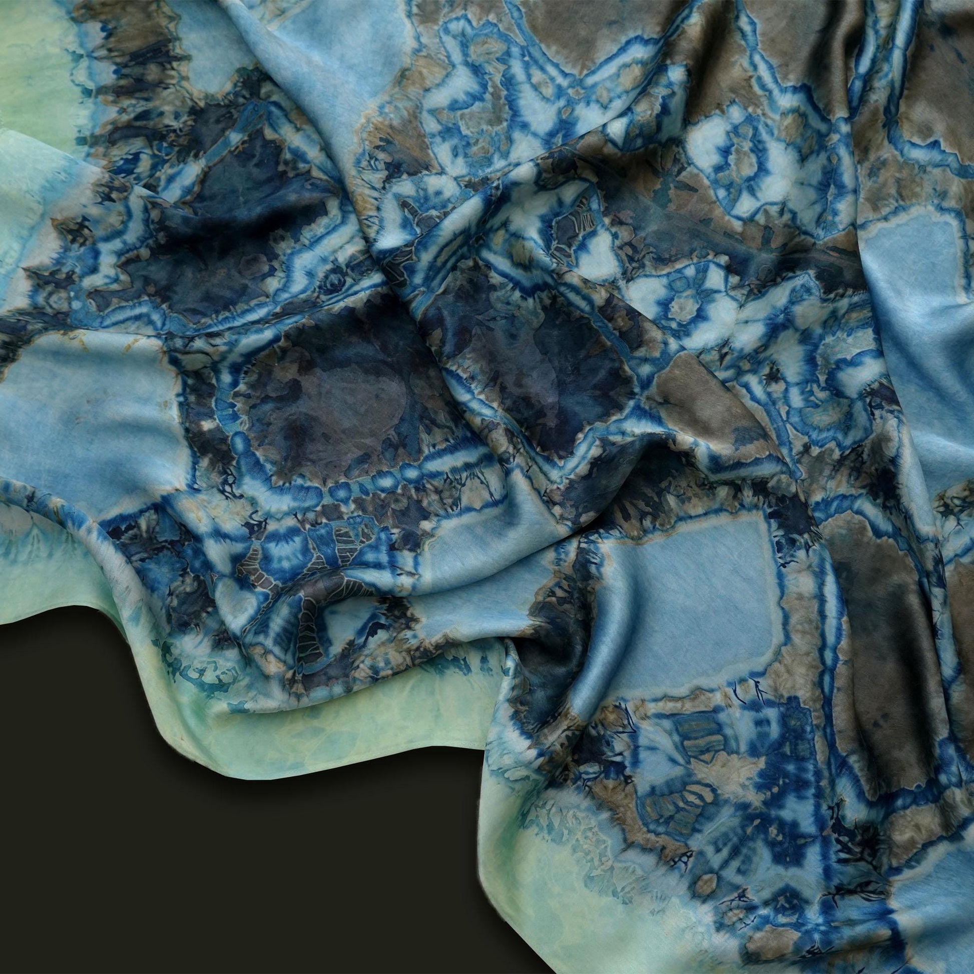 flat-lay view of Scarf — Deep Teal highlighting the natural dye and motif