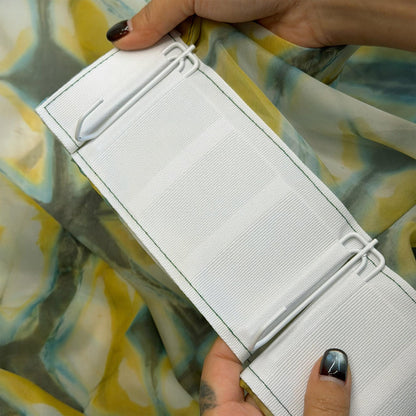 detail view of Pattern Drapery — Moss Yellow showing plant-dyed pattern and sheer drape