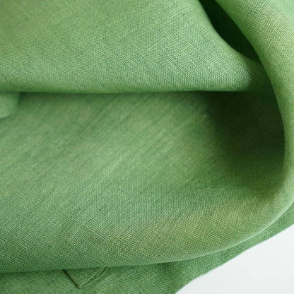 close-up of Soft Tone Noren — Leaf Green showing the natural resist-dye motif on linen